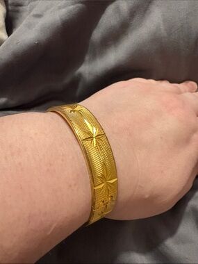 Gold Star-Embossed Bangle Bracelet